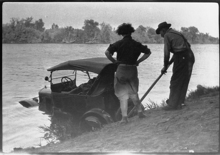 Two ancestors pulling a Model T out of a river. Not sure who, where, or when. Possibly Laura and Gil.