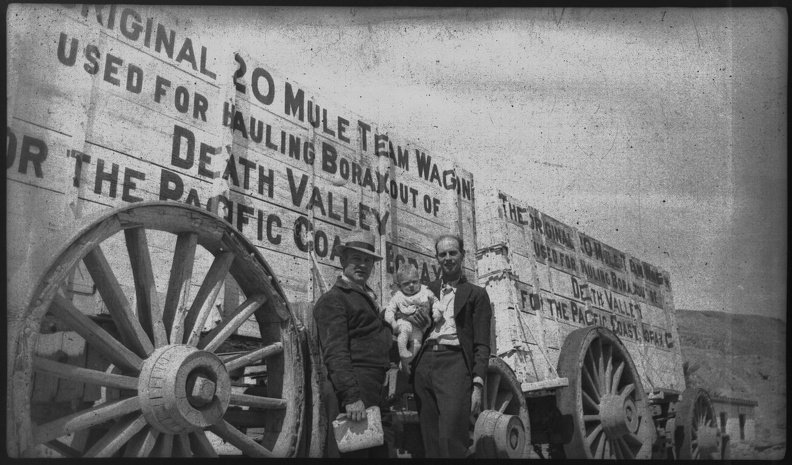 George and Gil. Writing on the train reads,
"Original 20 Mule Team Wagon Used For Hauling Borax Out Of Death Valley For Th