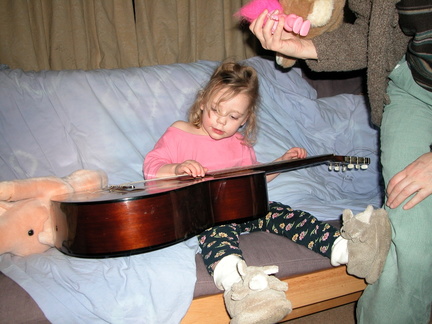 Grace playing the guitar