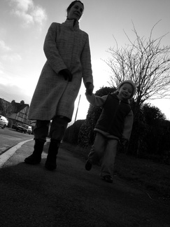 Anna and Grace walking down Station Road in Woodmancote