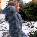 Grace throwing a snowball at the neighbour