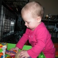 Mia playing in the toy box