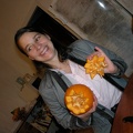 Anna carving a pumpkin