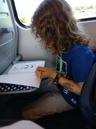 Isaac sketching on the train.jpg