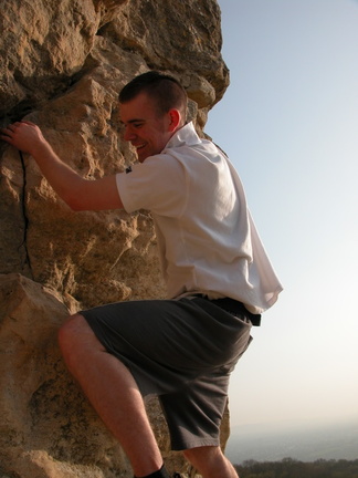 Peter Rawcliffe climbing a cliff