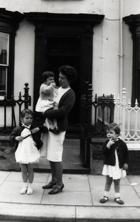 Anna, Ruth being held by Celia and Clare outside 27 Gwyder Crescent