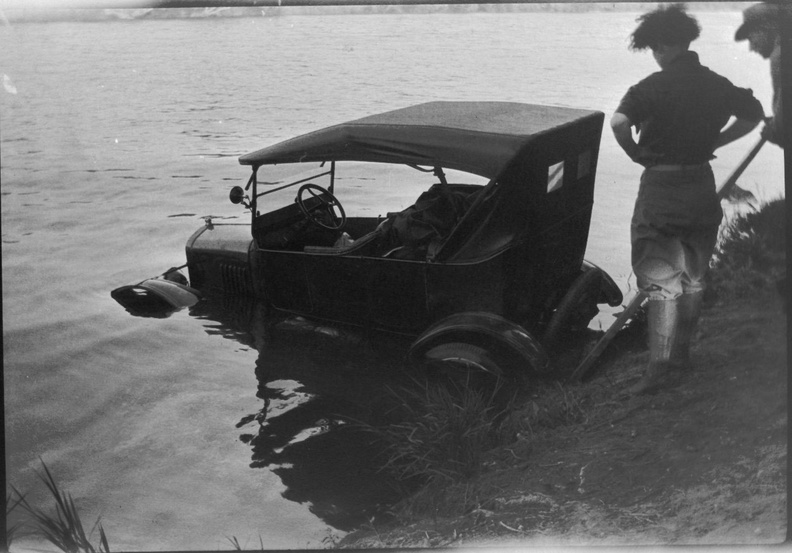 Two ancestors pulling a Model T out of a river. Not sure who, where, or when. Possibly Laura and Gil.