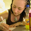 Kirsty writing a postcard
