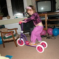 Grace playing with her new scooter. Maybe someone should have bought a belt for her birthday. And braces.