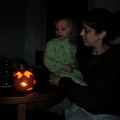 Grace and Julia looking at a pumpkin