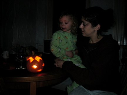 Grace and Julia looking at a pumpkin