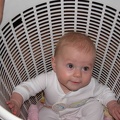 Mia sitting in a washing basket