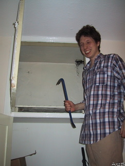 Rob opening the cupboard