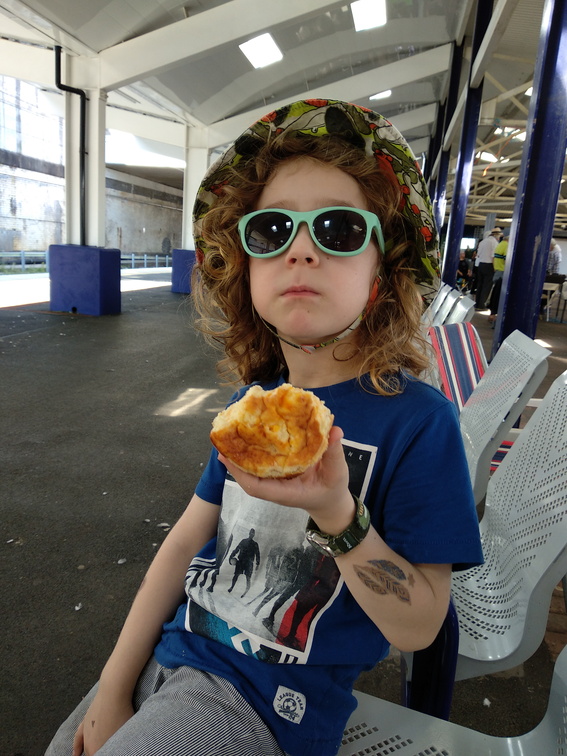 Isaac enjoying a quiche a Bolton station.jpg